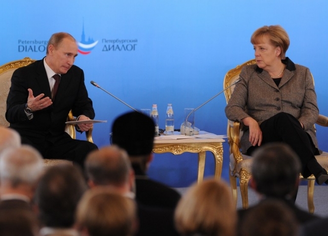 Путін та Меркель пропонують мирні переговори з терористами у форматі відеоконференції