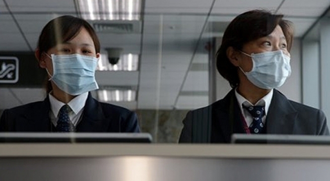 У Китаї з'ясовують, чи поширюється новий грип від людини до людини