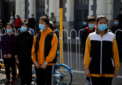 У Китаї вшанували померлих від коронавірусу (фоторепортаж)