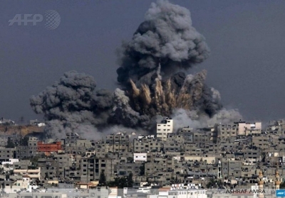 Сектор Гази, 29 липня 2014 року. Ізраїль здійснив ракетні удари по місту Газа. Військова операція Ізраїлю проти руху ХАМАС розпочалася 8 липня. Її причиною стали обстріли, які здійснювали бойовики ХАМАС. Фото: АFР