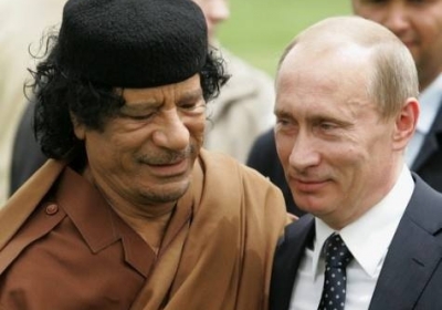Муаммар Каддафи, Владимир Путин Фото: AFP