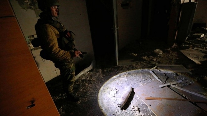 В морге лежат 14 тел военных, которые погибли в боях за Донецкий аэропорт, - журналист
