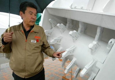Кіоші Амемія, президент Hitachi Construction Machinery. Фото:AFP.