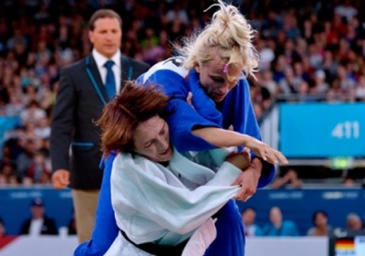 Юлія Галінська (в синьому) проти Кармен Брюссіг Фото: Getty Images