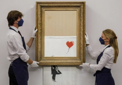 Картину Бенксі, частково порізану шредером, продали за рекордні $25,4 млн